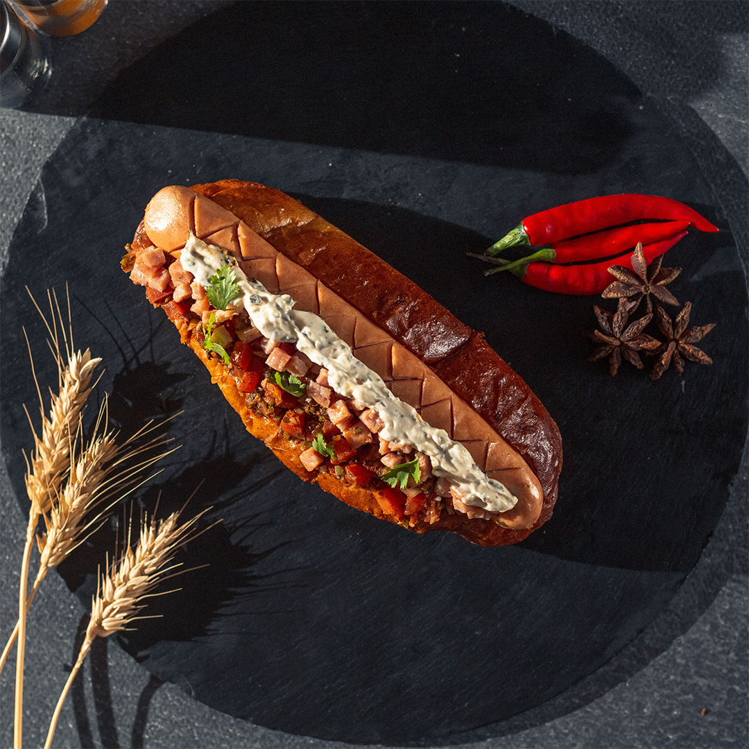 hot dog in the plate with red chili and star anise