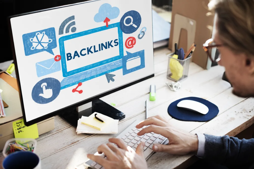 Person on computer analyzes website backlinks, visualizing the power of SEO strategy. Grow your online reach with smart linking.