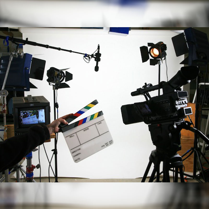 Filming set, high quality cameras along with comprehensive coverage equipment including microphones and tv monitors